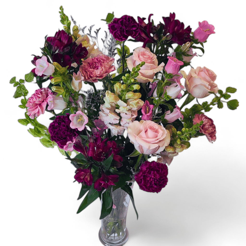 Princess Diana - Florist Atropa Belladonna A Beautiful bouquet in a princess trumpet vase, featuring rich purples and hot reds, and pink hues.