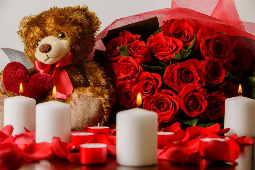 Grand gesture 2 dozen roses - Florist Atropa Belladonna 2 dozen roses with a teddy, candles, and rose petals