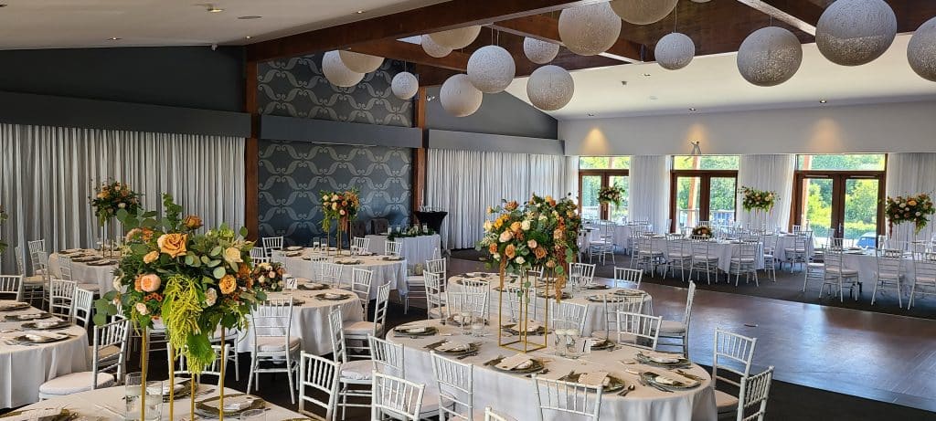 Reception Flowers at Rigaud, Quebec - Florist Atropa Belladonna Tall and low centerpieces set at the reception hall in Rigaud, QC from our Montreal flower shop.