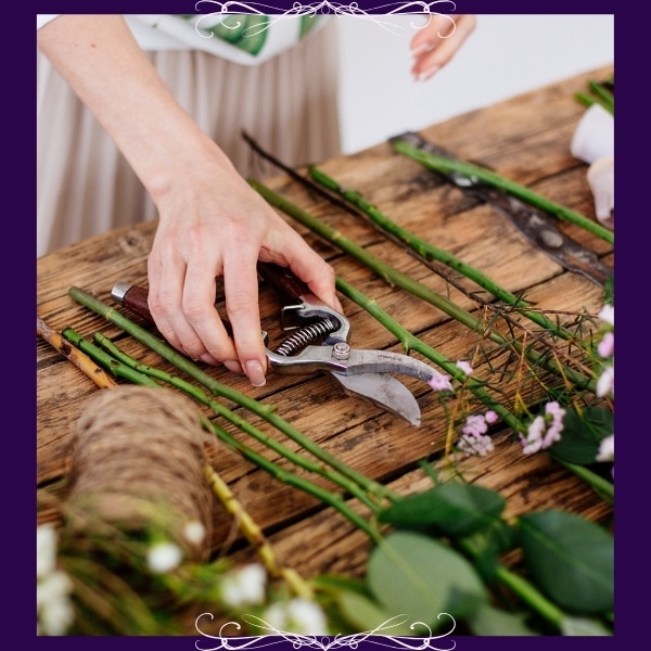 Designing in Progress - Florist Atropa Belladonna designing flowers, beginning stages, cut stem and tools